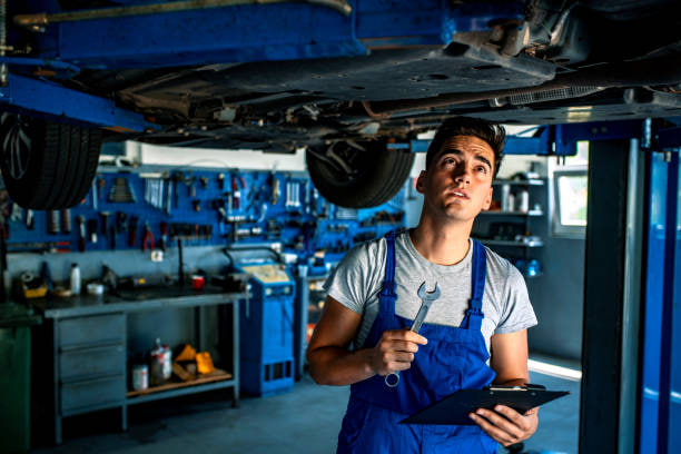 Professional mechanic working on a vehicle engine